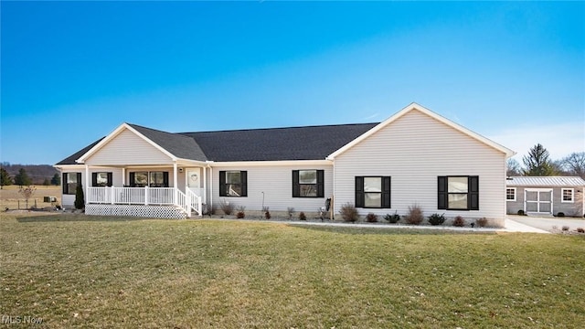 ranch-style home featuring a porch, a front lawn, and a shingled roof