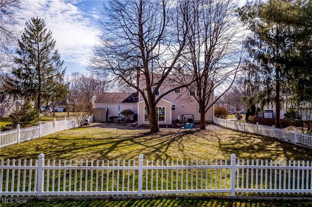 view of front of house with a front yard and a fenced front yard