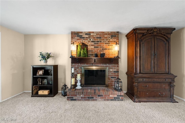 carpeted living area with baseboards and a brick fireplace