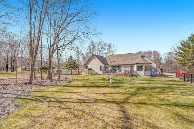 view of yard featuring a deck and fence