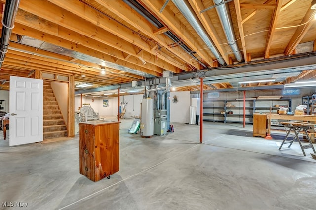 unfinished basement featuring stairs, gas water heater, and heating unit