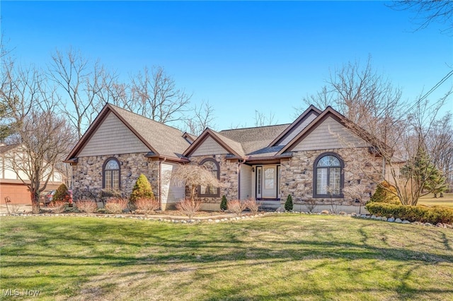 view of front of home featuring a front lawn and stone siding