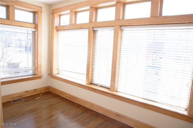 unfurnished sunroom with visible vents