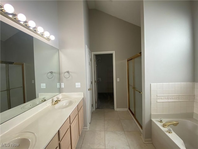 bathroom with a sink, a garden tub, a stall shower, and double vanity