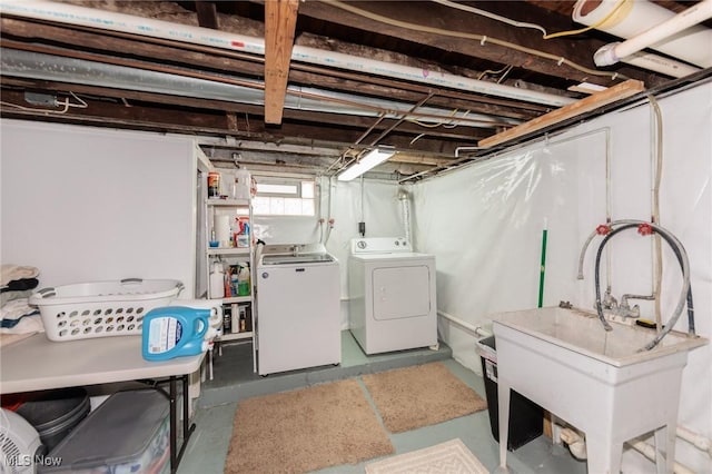 below grade area with washing machine and dryer and a sink