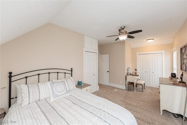 bedroom with baseboards, light carpet, ceiling fan, and vaulted ceiling