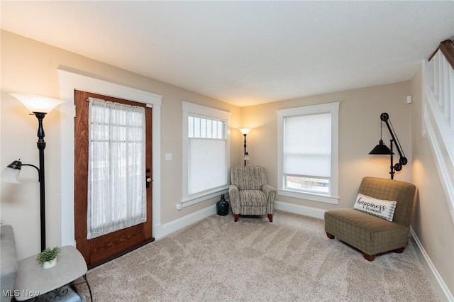 living area with carpet and baseboards