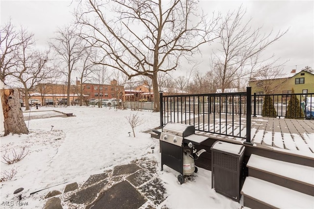 snow covered deck with area for grilling