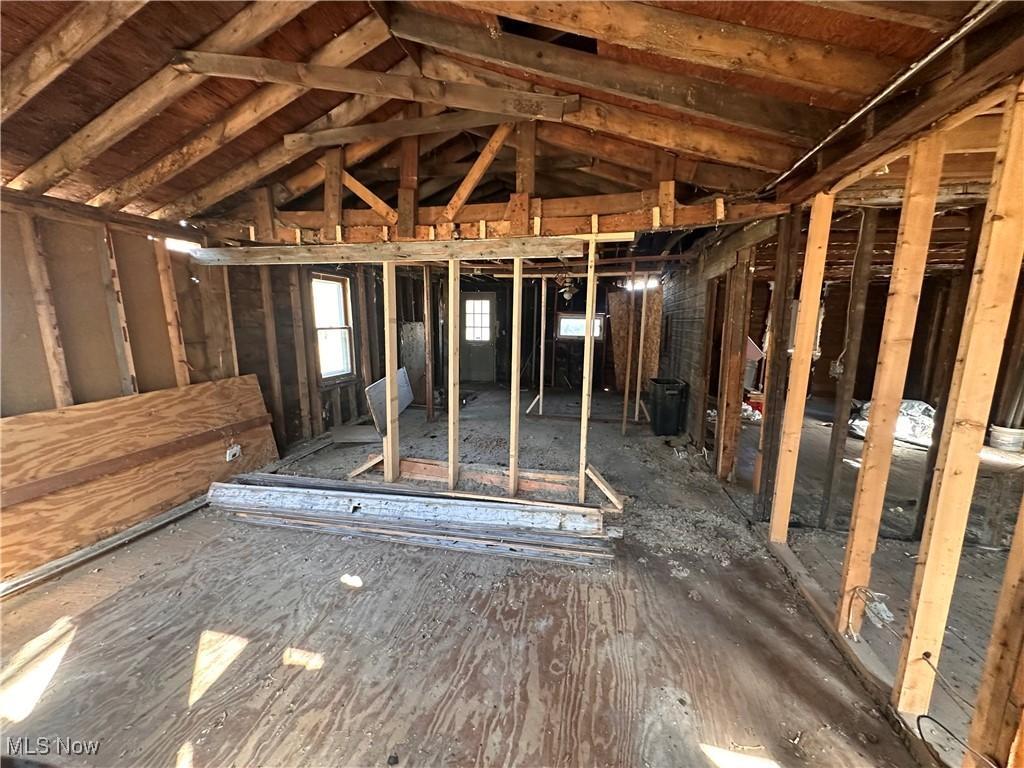 miscellaneous room with lofted ceiling