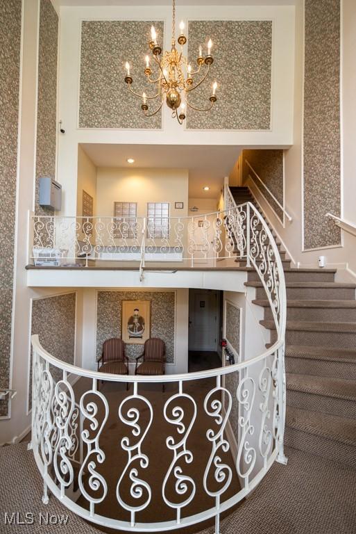 reception area with a chandelier and stairs