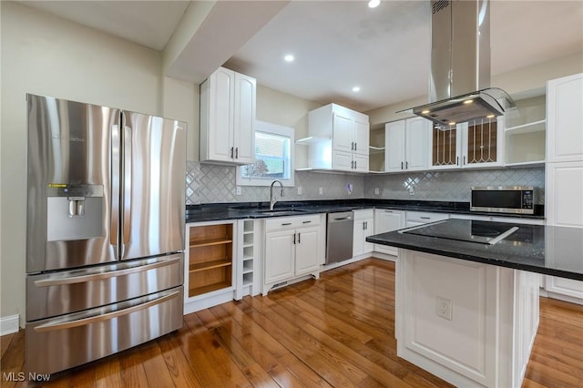 kitchen featuring open shelves, a sink, appliances with stainless steel finishes, white cabinetry, and island range hood