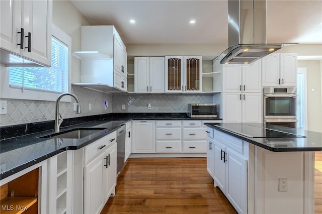 kitchen with island range hood, a sink, stainless steel appliances, and open shelves