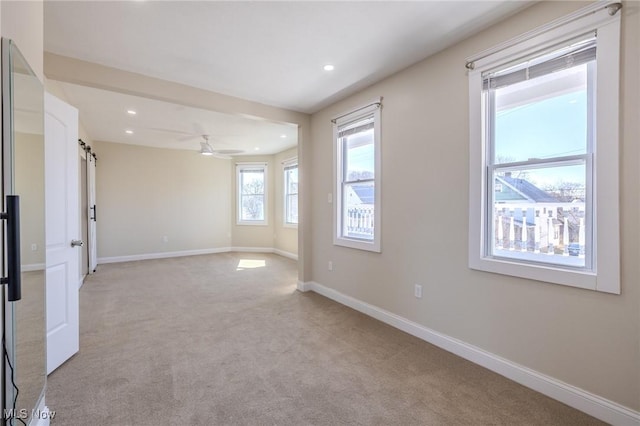 unfurnished room with recessed lighting, baseboards, light colored carpet, and ceiling fan