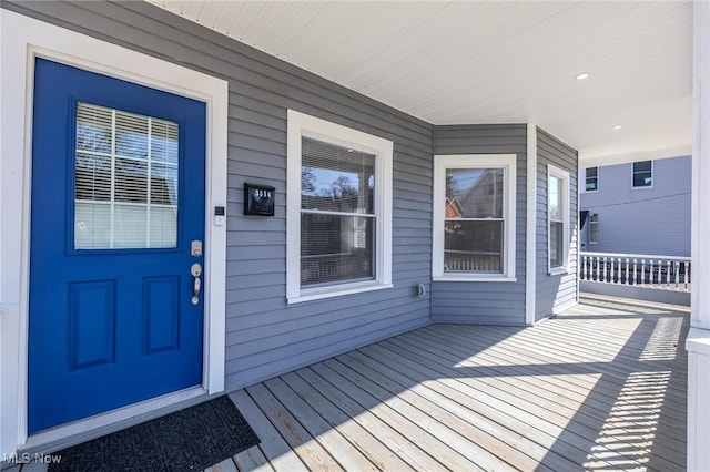 doorway to property featuring covered porch