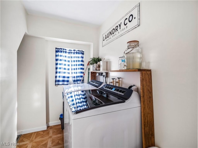 kitchen featuring separate washer and dryer and baseboards