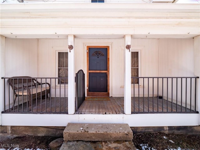 entrance to property with covered porch