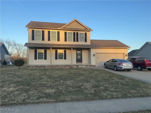 view of front of home with a front yard, concrete driveway, and an attached garage