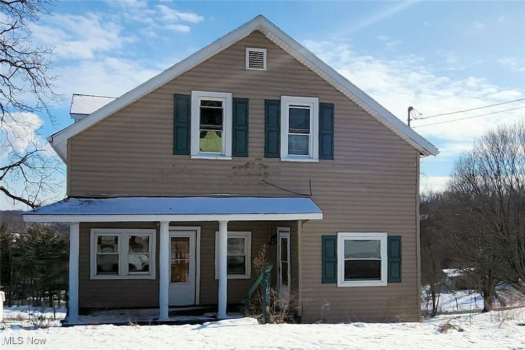 traditional-style house with covered porch