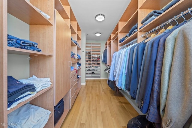 spacious closet with light wood-style floors