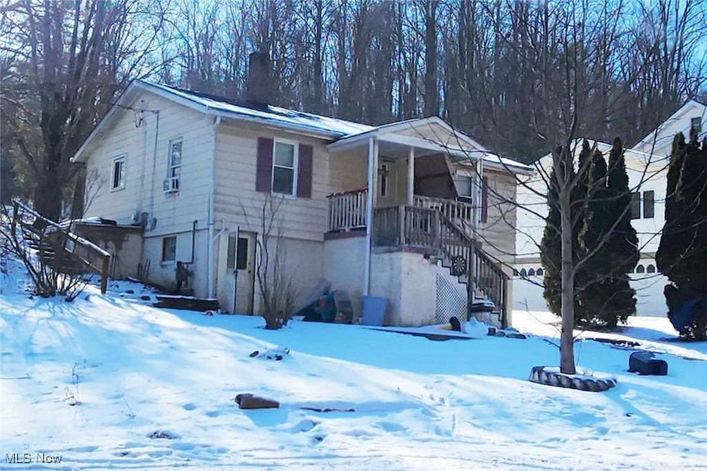 view of front of home featuring stairs