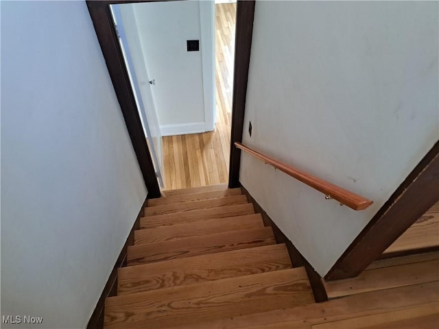 stairs with wood finished floors