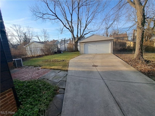 exterior space with a detached garage and an outdoor structure