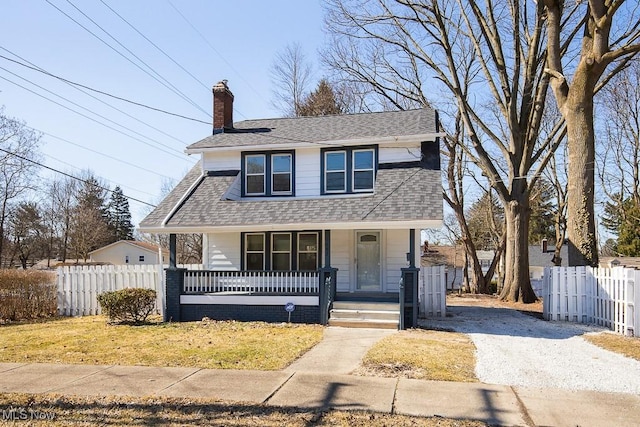 view of front of house with a porch, fence, roof with shingles, and a chimney