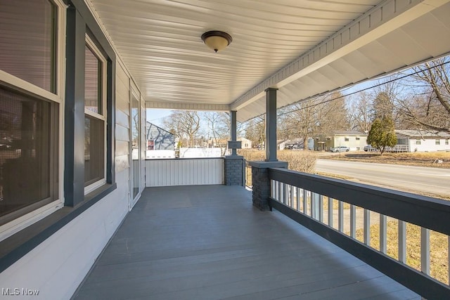 view of patio / terrace featuring covered porch and a residential view