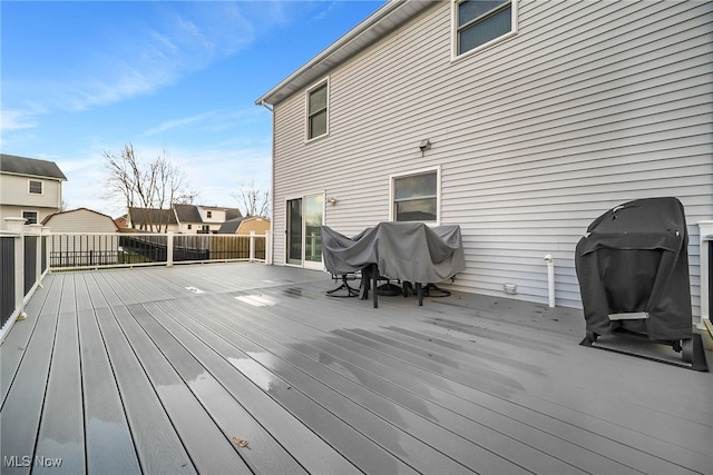 wooden terrace featuring grilling area