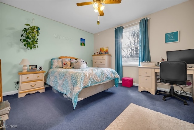 carpeted bedroom with a ceiling fan and baseboards