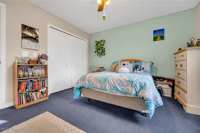 carpeted bedroom featuring a closet and a ceiling fan