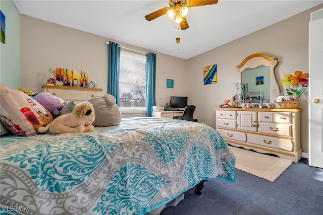 bedroom with a ceiling fan and carpet flooring