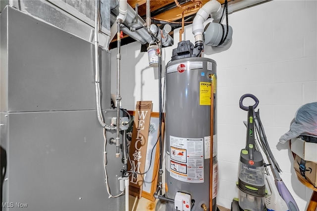 utility room with gas water heater and heating unit