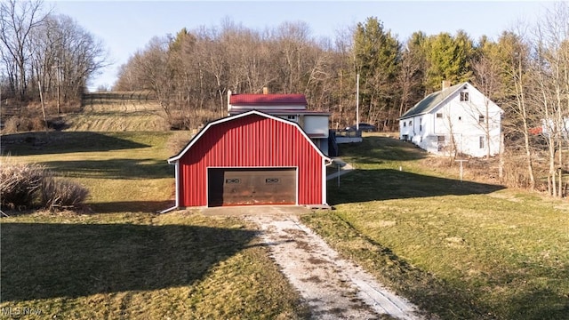 view of outbuilding with an outbuilding and dirt driveway