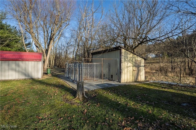 view of yard featuring an outbuilding and a shed