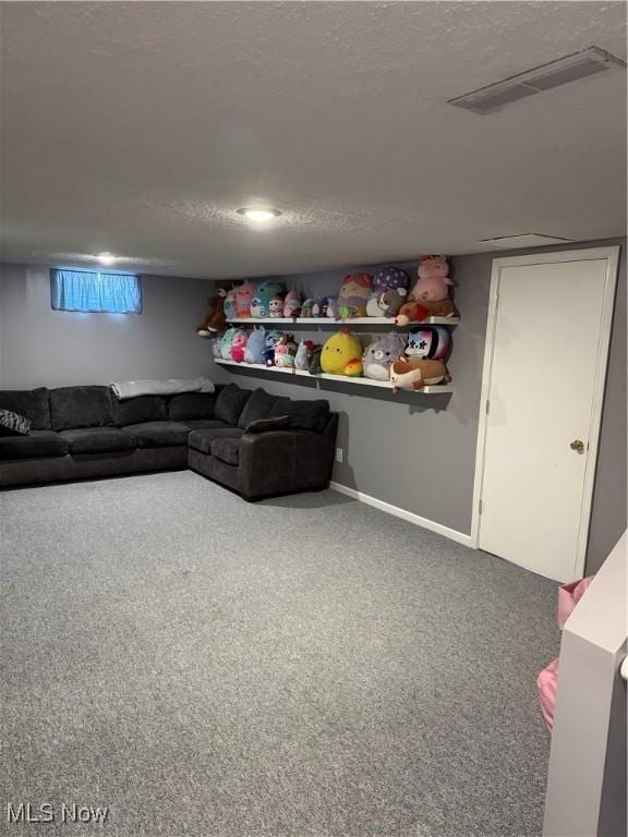 carpeted living room with baseboards, visible vents, and a textured ceiling