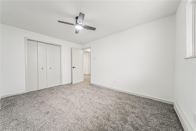 unfurnished bedroom featuring a closet, baseboards, carpet, and ceiling fan