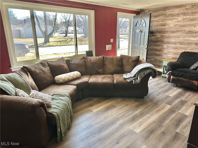 living area with wood finished floors and a textured ceiling