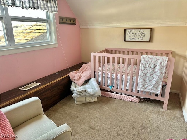 bedroom featuring vaulted ceiling and carpet floors