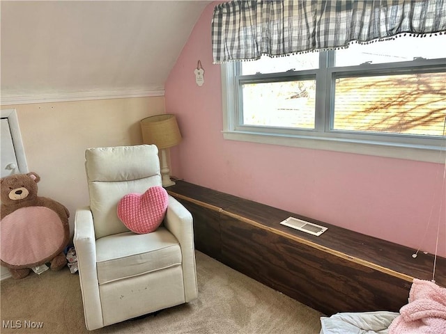 sitting room featuring vaulted ceiling, visible vents, and carpet floors