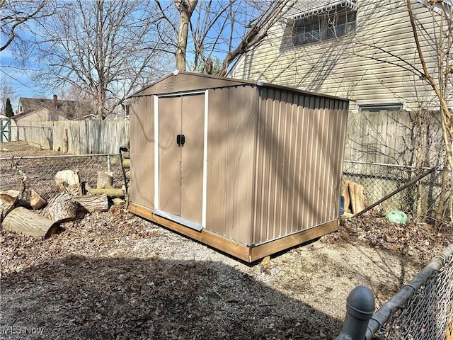 view of shed featuring a fenced backyard