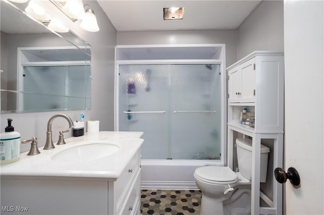 full bath featuring vanity, toilet, and enclosed tub / shower combo