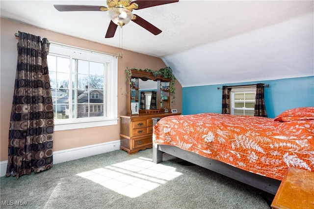 bedroom with ceiling fan, baseboards, carpet, and vaulted ceiling