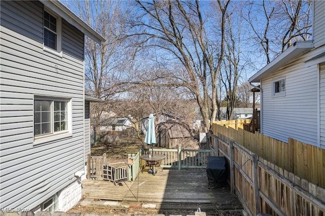 wooden deck featuring fence