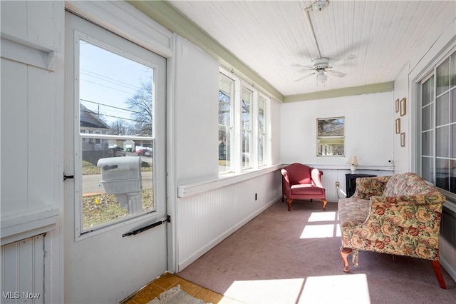 sunroom with a wealth of natural light and ceiling fan