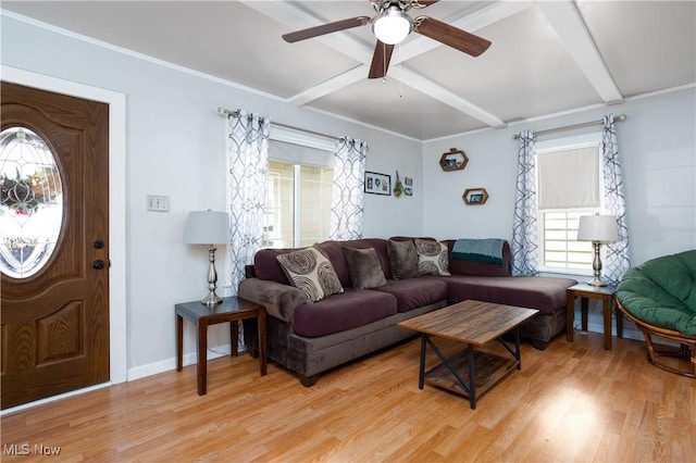 living area featuring beam ceiling, a ceiling fan, baseboards, and light wood finished floors