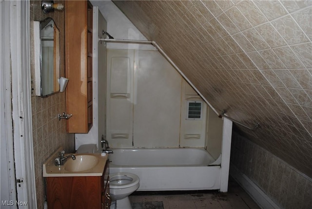 full bath featuring visible vents, tub / shower combination, toilet, vanity, and tile walls