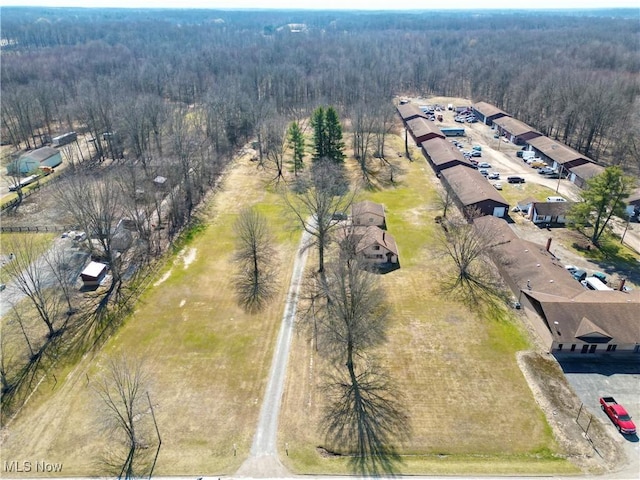 birds eye view of property with a forest view