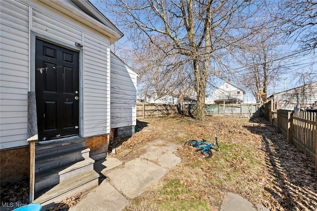 doorway to property with fence