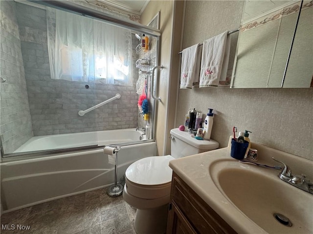 full bathroom featuring bath / shower combo with glass door, vanity, and toilet